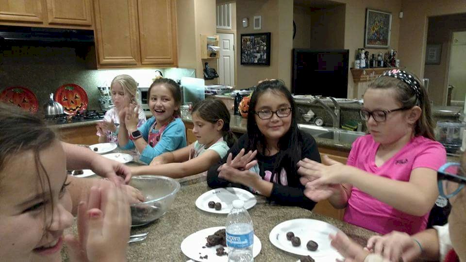 Junior Girl Scouts Earning Chocolate Patch