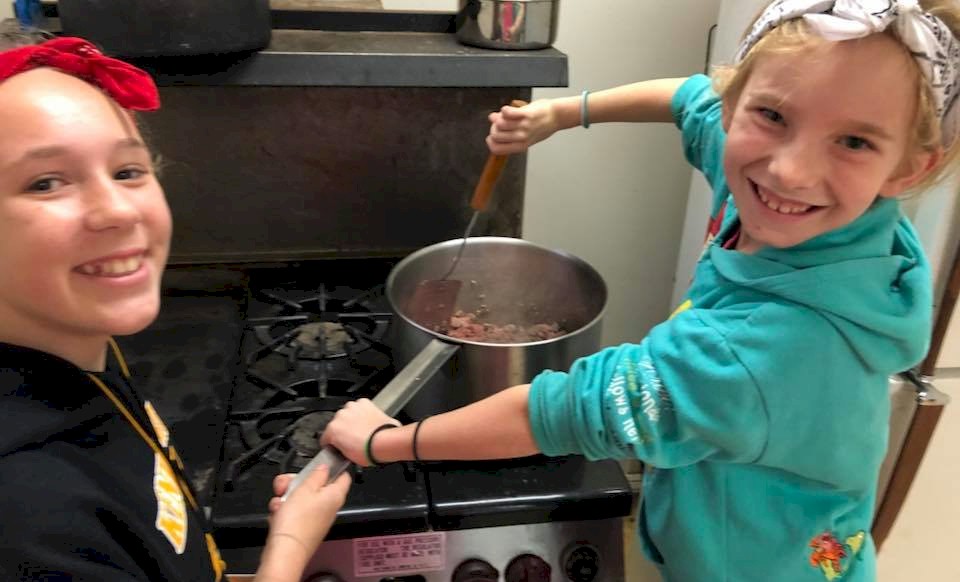 Brownie Girl Scouts Cooking at Camp