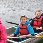 Cindy Smith's Cadette troop in a canoe while camping.