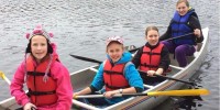 Cindy Smith's Cadette troop in canoe while camping.