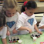 Daisy Girl Scouts planting seeds