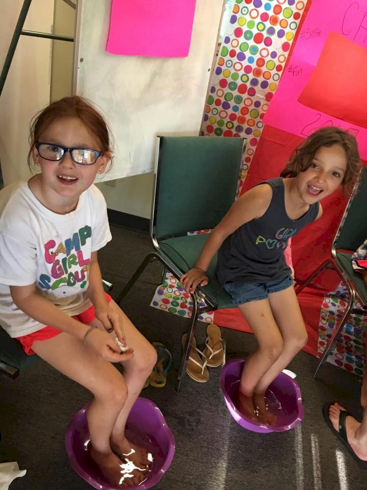 Brownie Girl Scout Getting Manicures and Pedicures