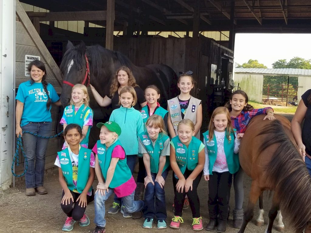 Junior Girls Scouts horseback riding.