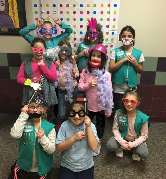 Junior Girl Scouts learning about photography.