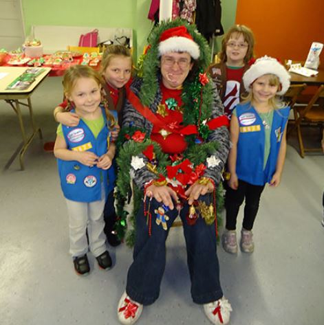 Girl Scout decorate leader at Christmas party