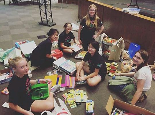 Girl Scouts doing a school supply drive.