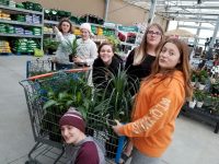 Cadette* Troops 1081 & 1074 of Prairie du Chien, Wisconsin  breathe take action project greening the school with year old plants and the help of community partners.