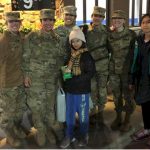 Junior Girl Scouts Give Cookies to Women in the Military.
