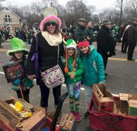 Here's a great way to earn a St. Patrick's Day patch. Junior Troop 806, Islip Terrace NY, having a walkabout sale during the East Islip St Patrick's Day parade. The girls were selling cookies over the sounds of bagpipe bands and fire department trucks and braving the cold to walk a mile and half in each direction to sell as many boxes as they could before the parade ended.