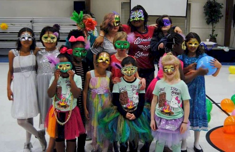 Girl Scouts at a masquerade ball.