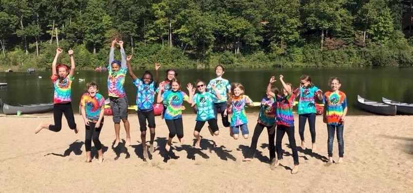 Cadette Girl Scouts get outdoors and go canoeing.
