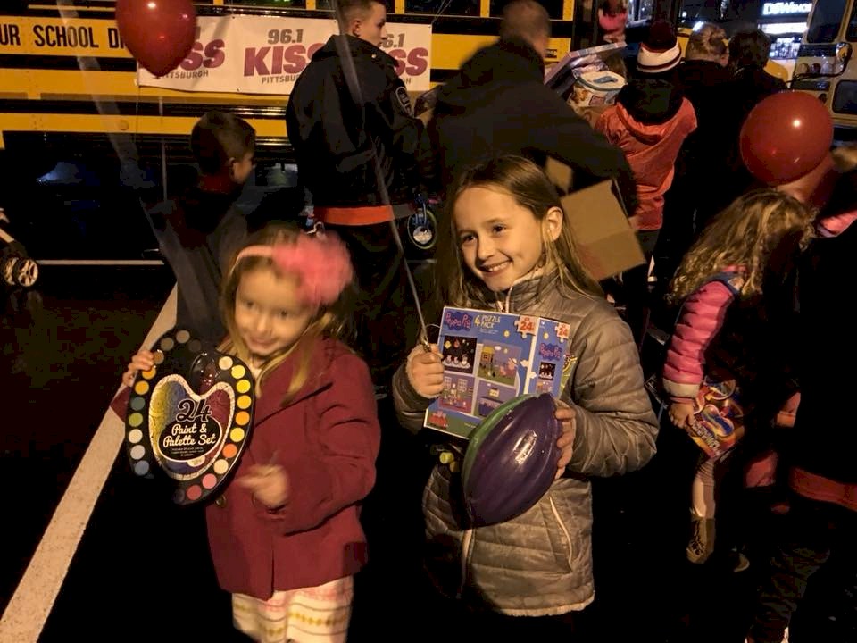 Daisy Girl Scout troop Delivering toys for Toys