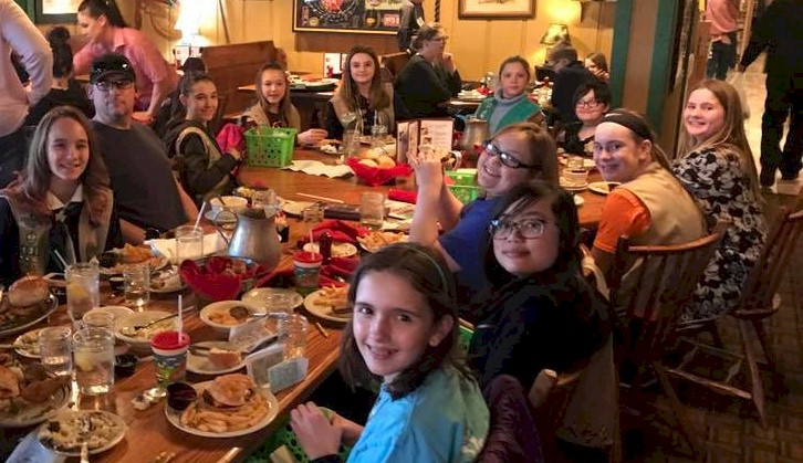 Girl Scouts enjoying a meal after touring the reastaurant.