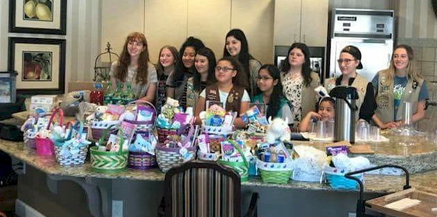 Girl Scouts fill Easter Baskets for assited living residents.