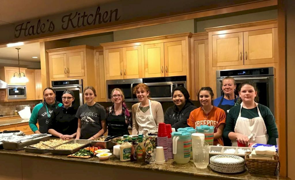 Girl Scout preparing dinner at the Ronald McDonald house.