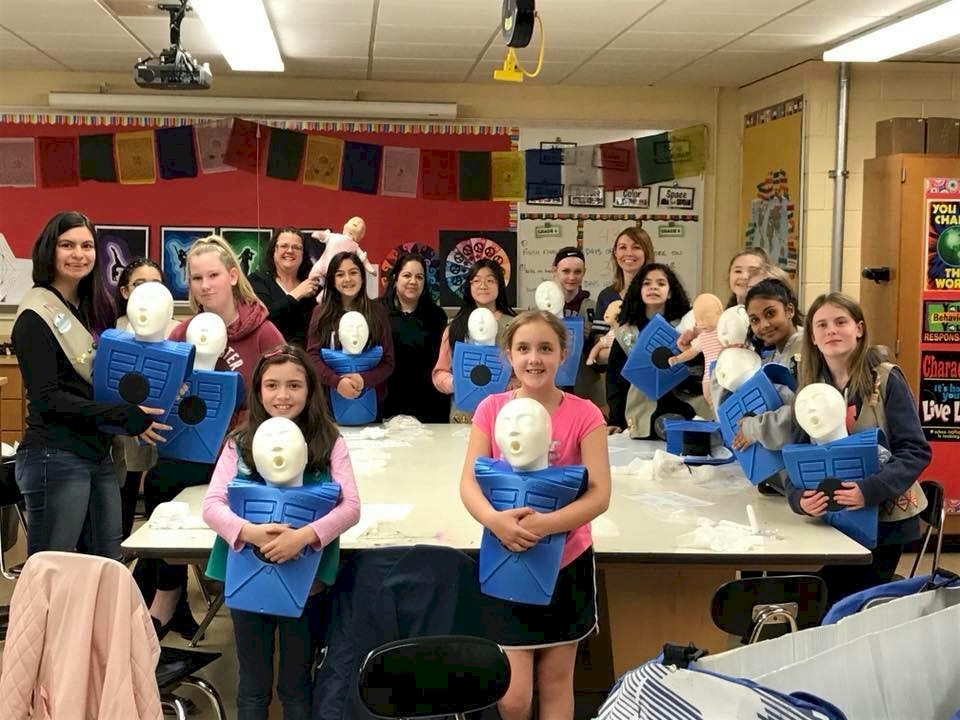 Girls Scouts learning CPR