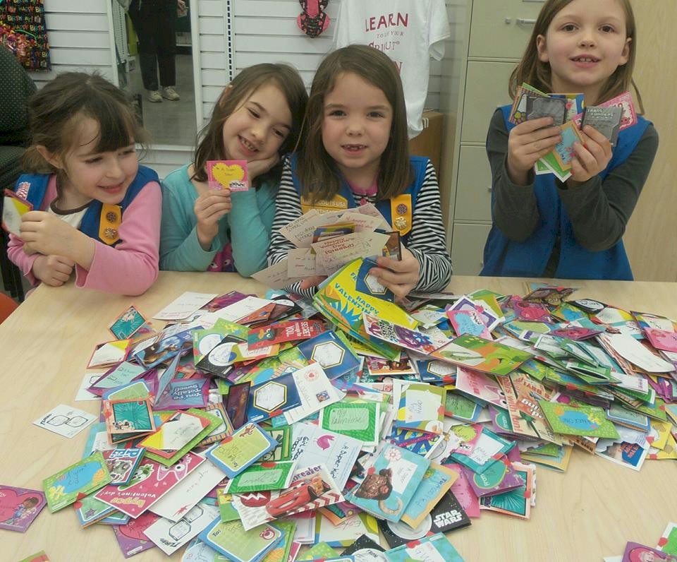Daisy Girl Scouts Signing Valentine Cards.