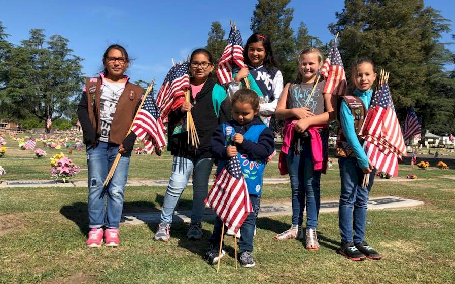 Girl Scout flag placement for our fallen military heroes.