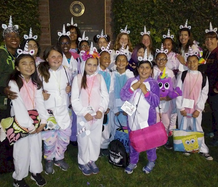 Cadette Girl Scouts Earning Their Night Owl Badge