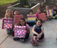 Junior Girl Scouts earning their Girl Scout Ways Badge