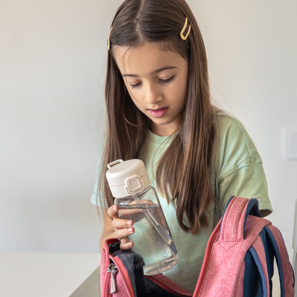 Brownie Girl Scout Packing for a Hike