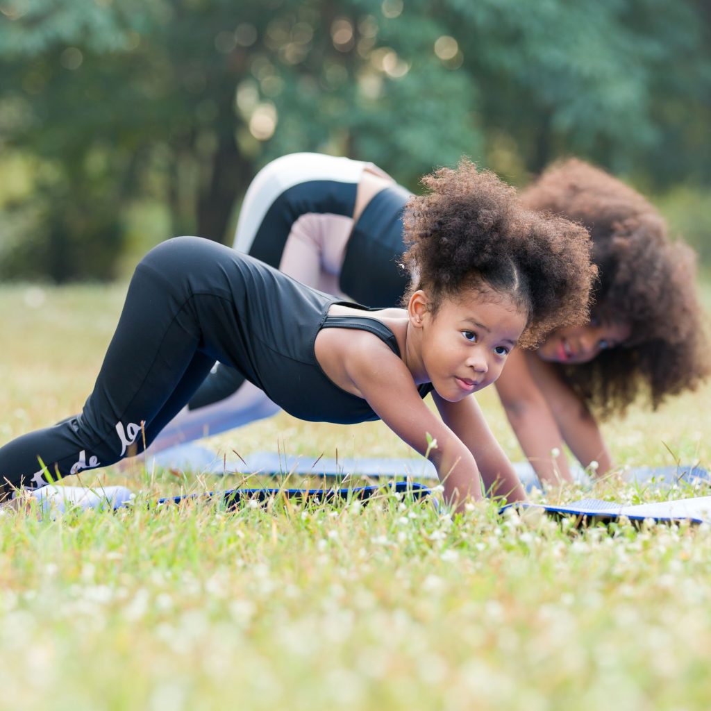Brownie Girl Scout Stretching Before Hiking